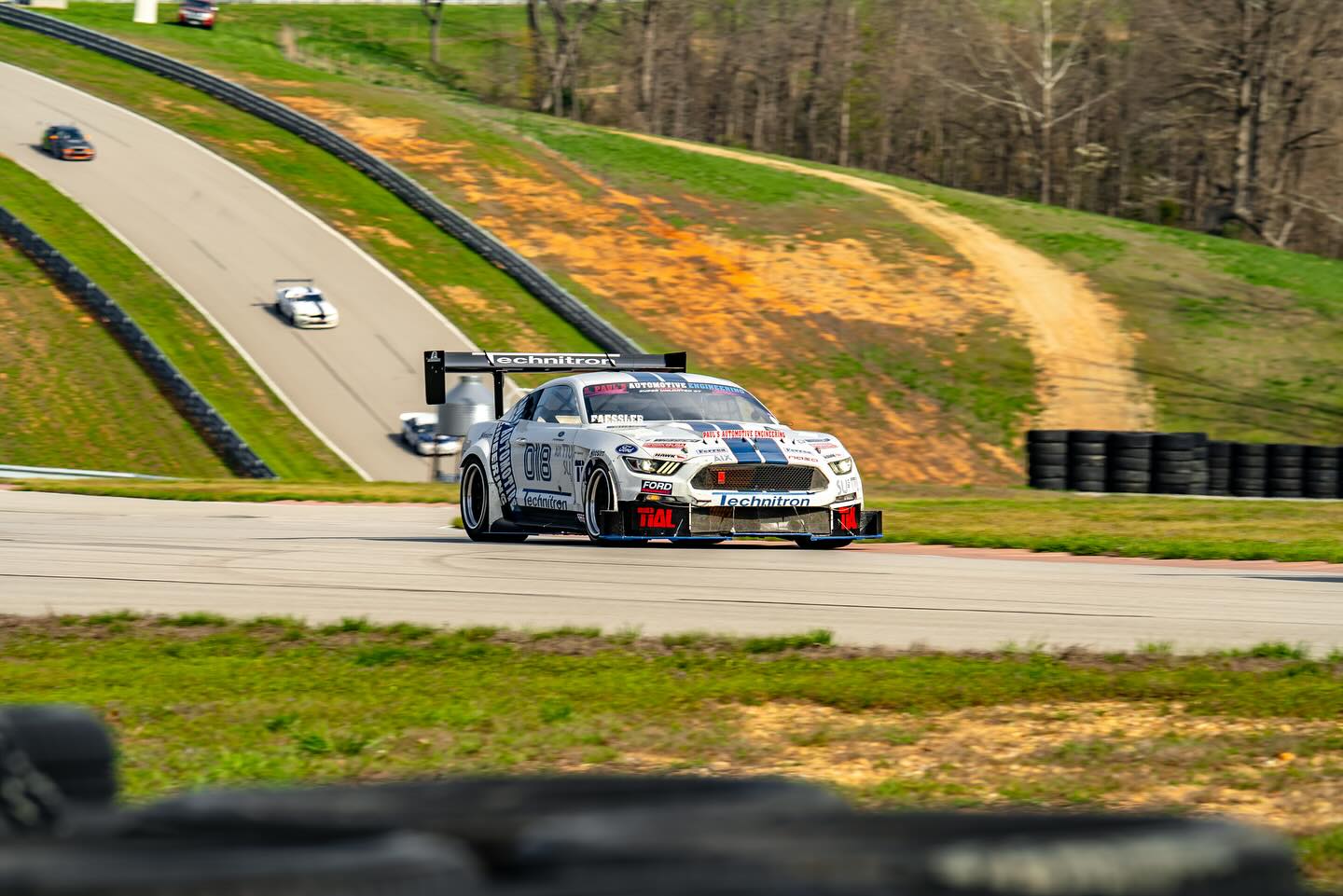 Paul's Automotive Engineering Mustang on track demonstrating AMB Aero's aerodynamic package
