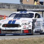 Paul's Automotive Engineering Mustang race car on track at Pittsburgh International Race Complex