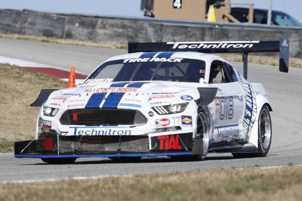 Paul's Automotive Engineering Mustang race car on track at Pittsburgh International Race Complex